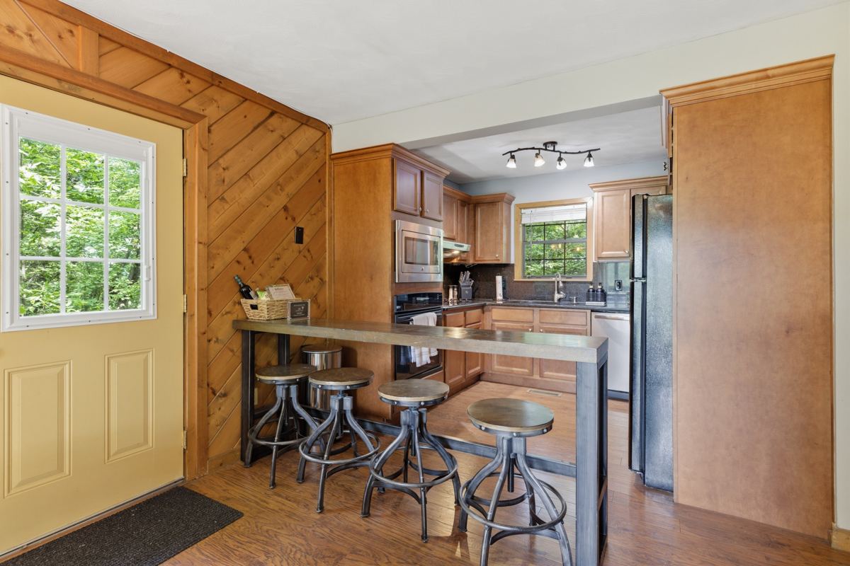 Kitchen with a breakfast bar and stools